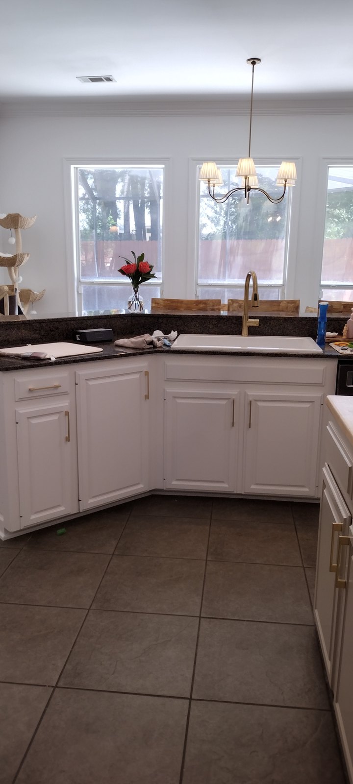 Refinished cabinetry in a bright breakfast nook kitchen