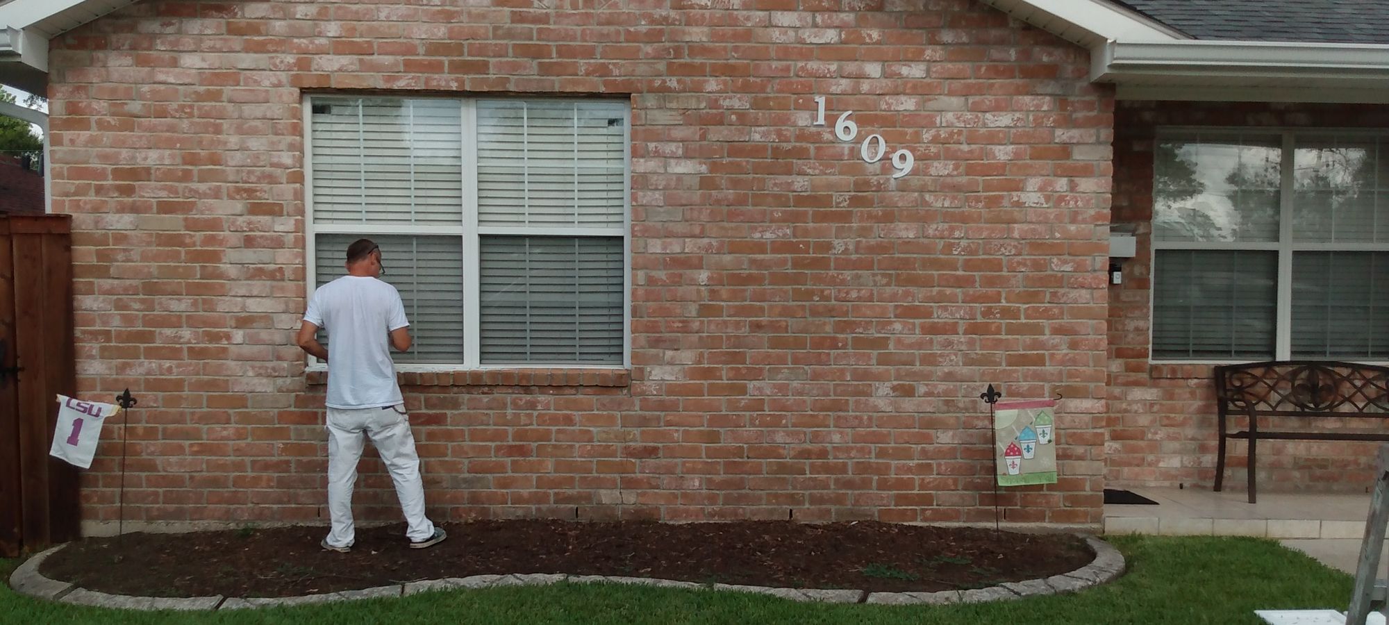 Howard's Painting at work on an exterior brick repaint