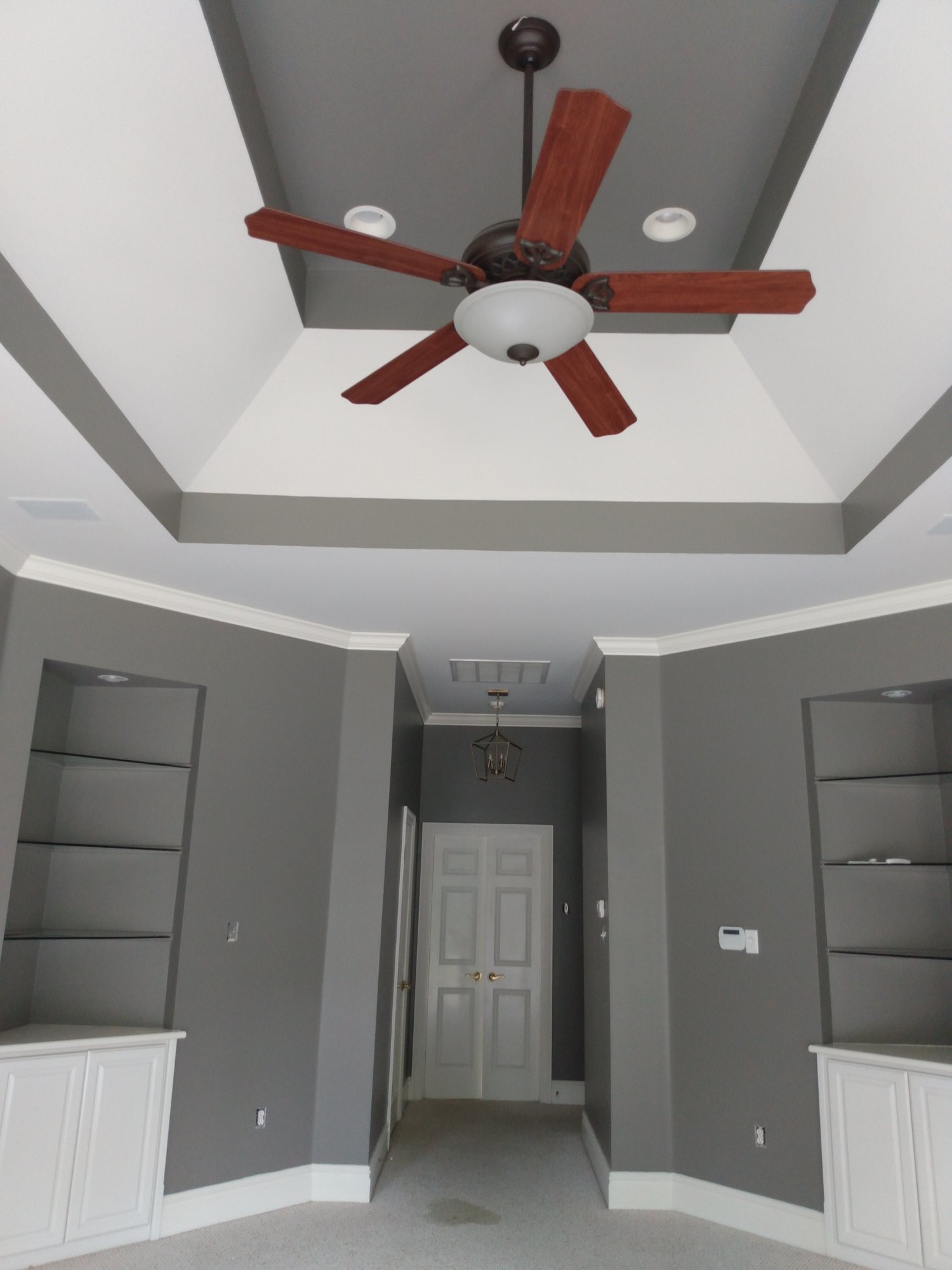 Interior repaint with gray walls, white trim and built-in shelving
