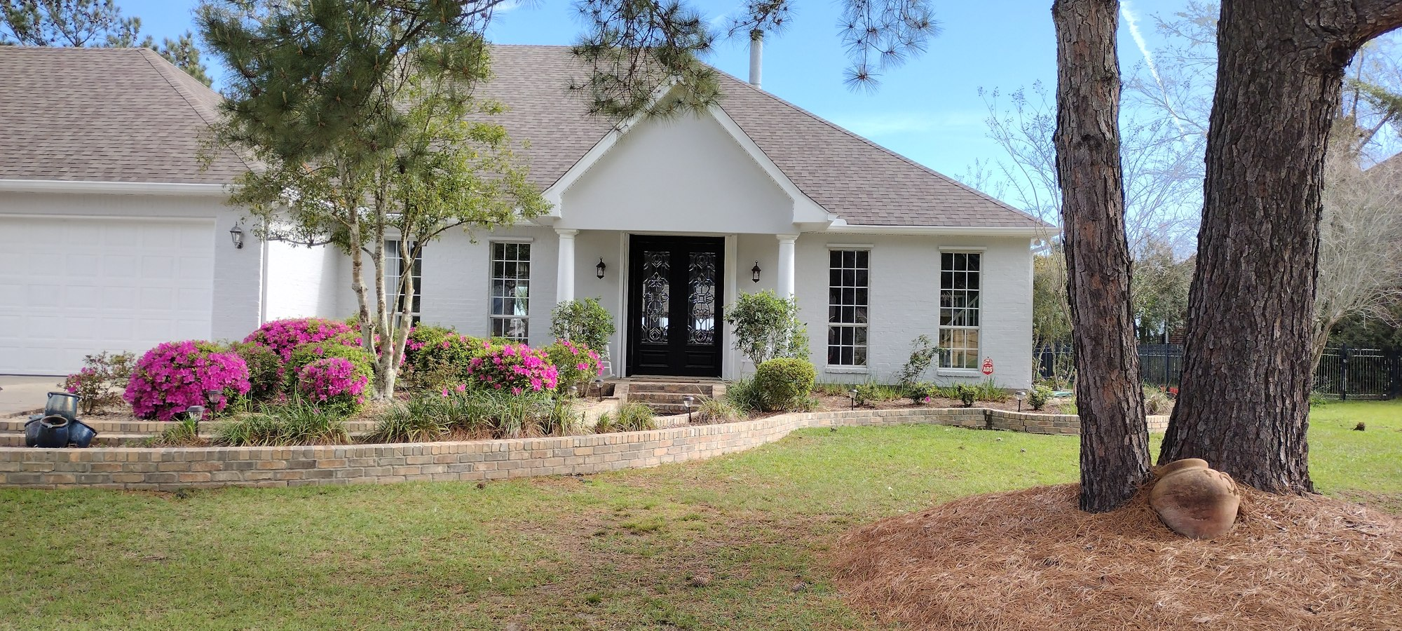 Same home's exterior freshly painted white