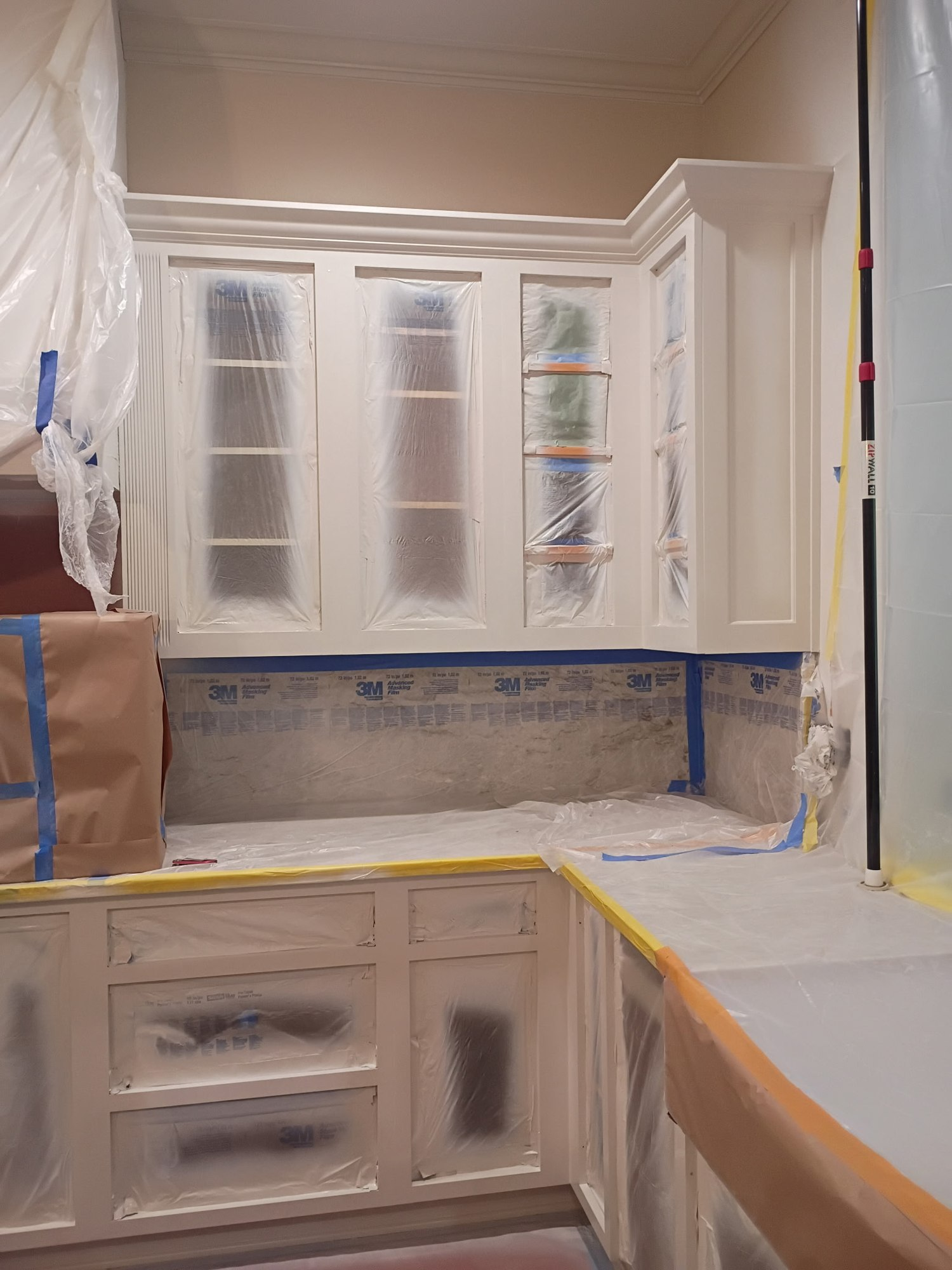 Cabinets masked and prepped before interior painting